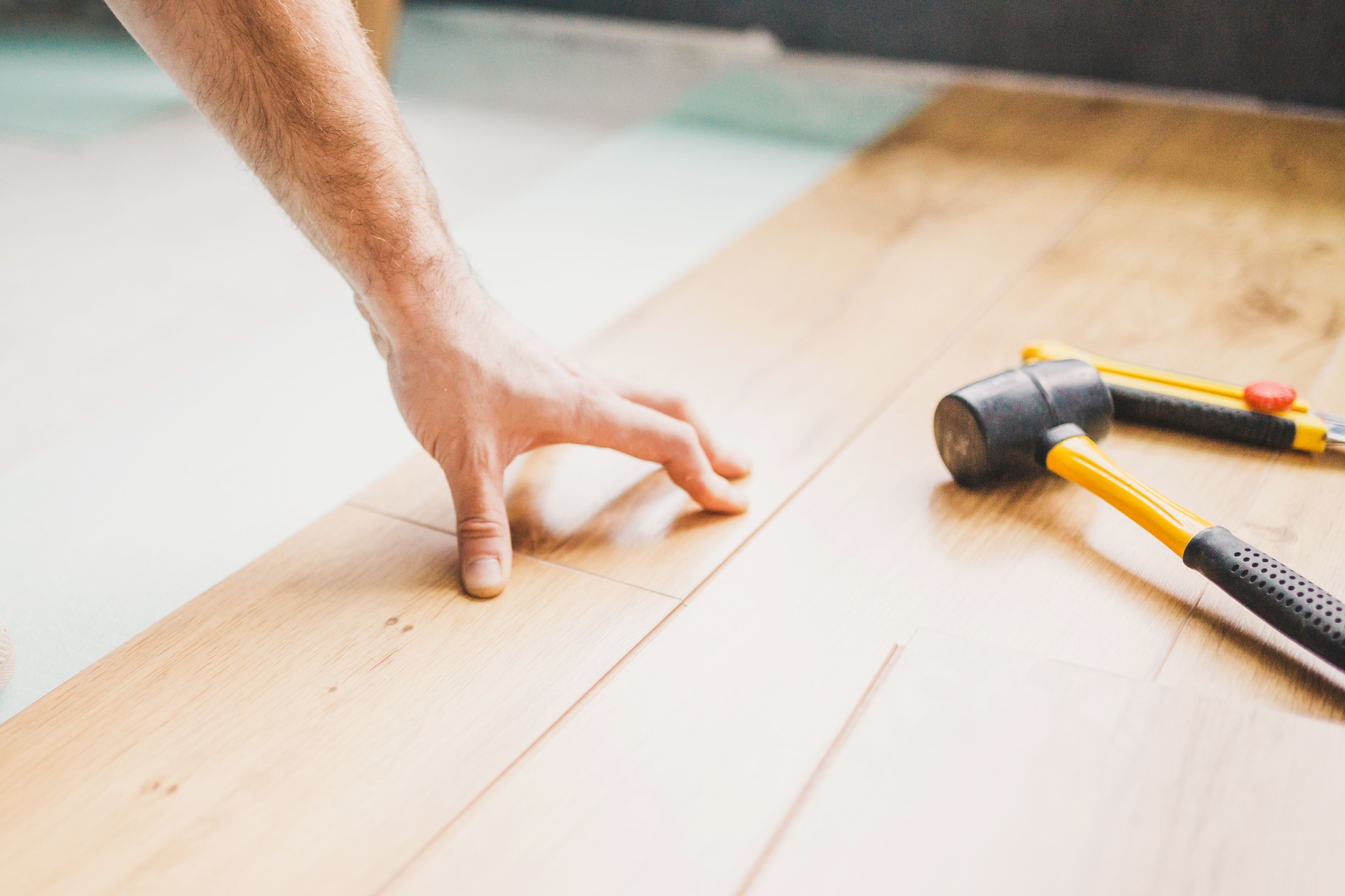 Finishing work at home - laying a laminate flooring